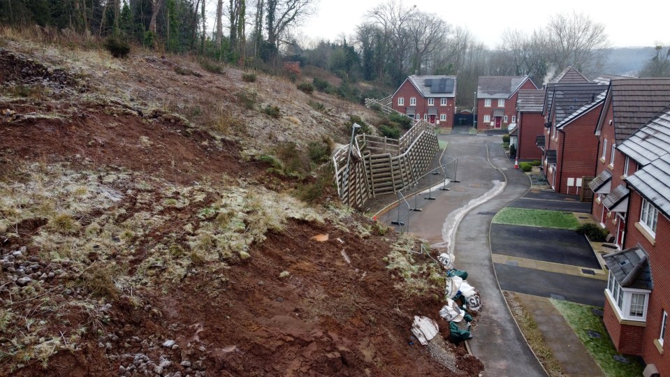 Massive landslip blocking road access to homes.