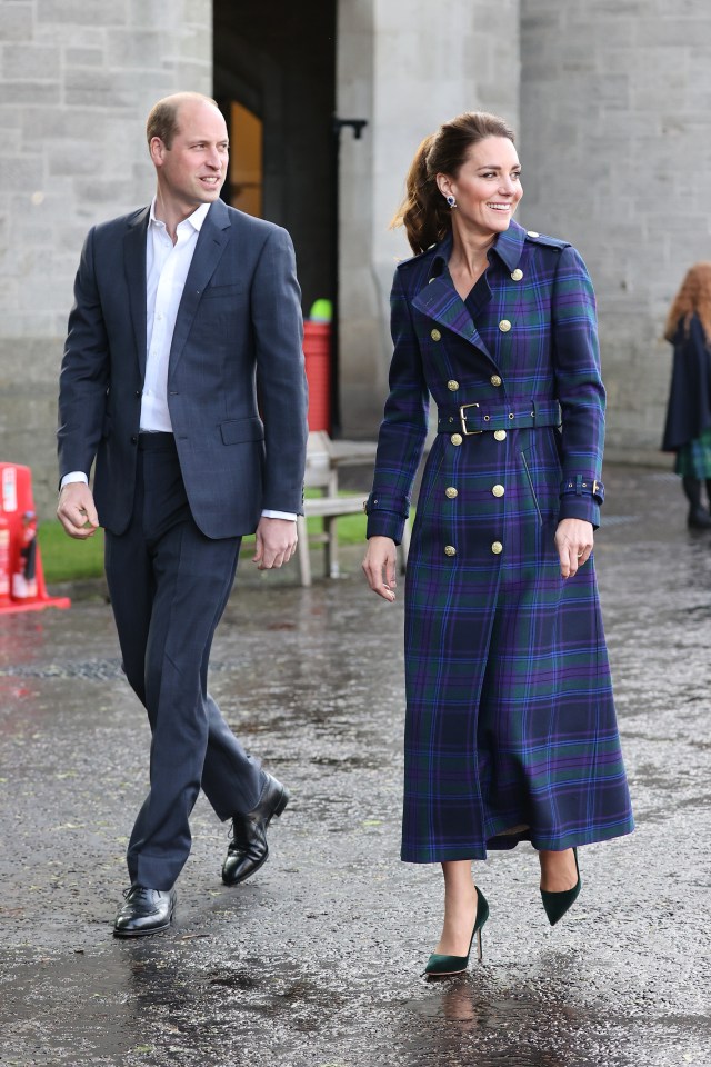 Kate and William walking, Kate wearing a tartan coat.