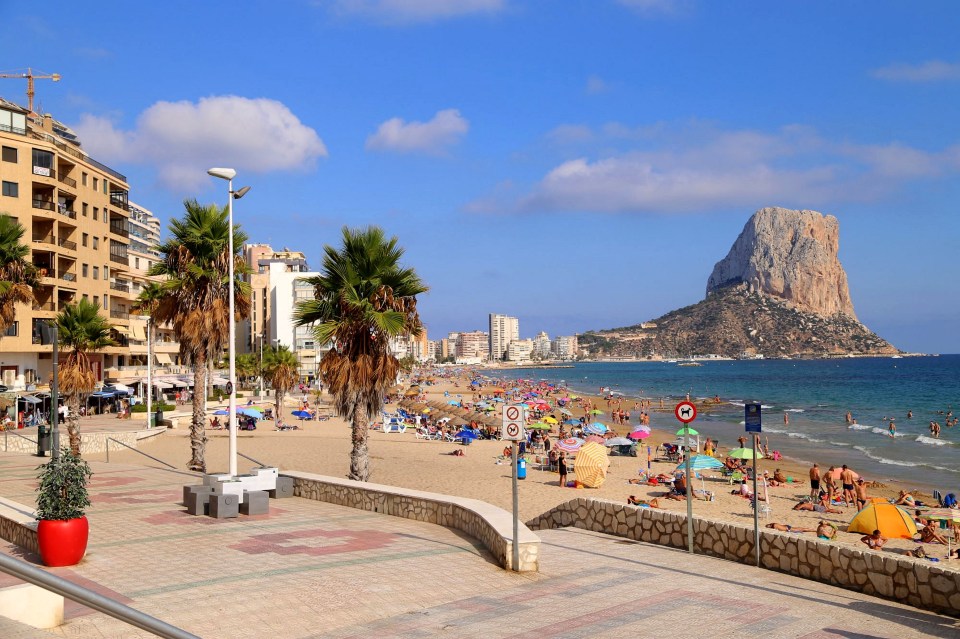 High-angle view of Benidorm's dense cityscape, hotels, and beach.