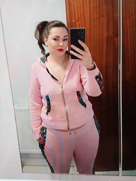 Missing person: Kylie Badham, 30, wearing a pink tracksuit with a butterfly tattoo.