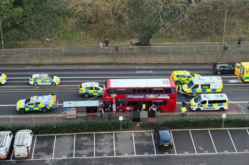 Police investigating a murder on a London bus.