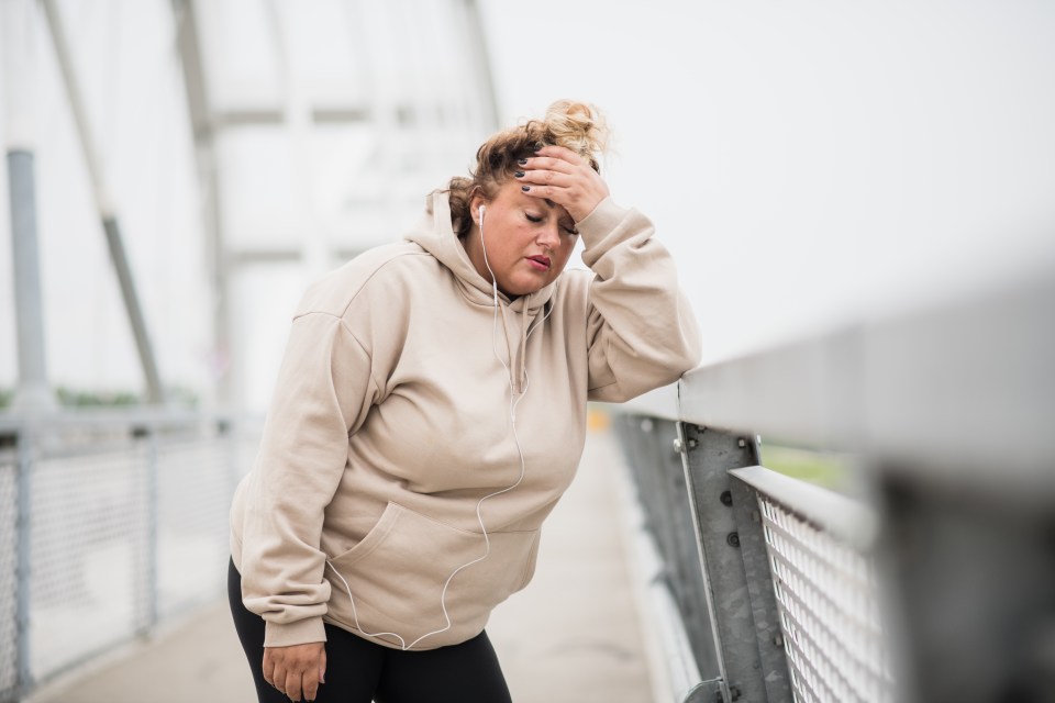 Overweight Latina woman resting after a workout.