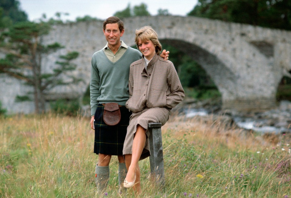 Prince Charles with his arm around Princess Diana at Balmoral.