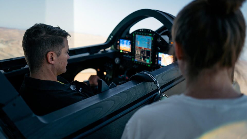 A pilot in a flight simulator.