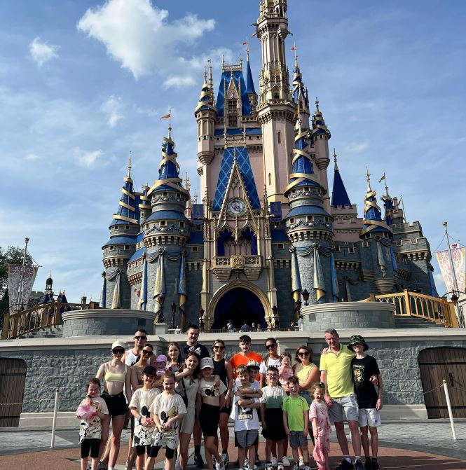 The Radford family in front of Cinderella Castle.