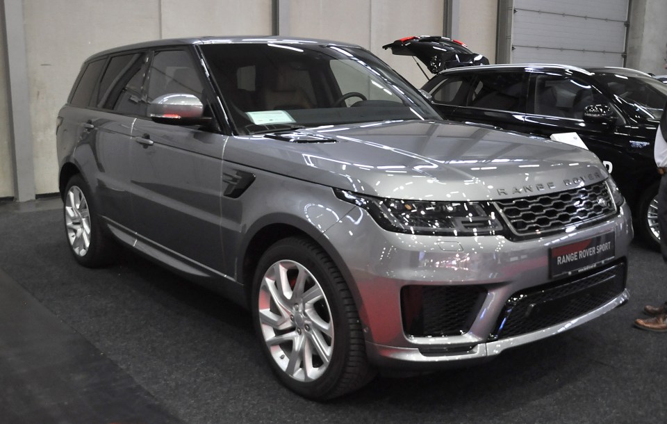 Silver Range Rover Sport at a car show.