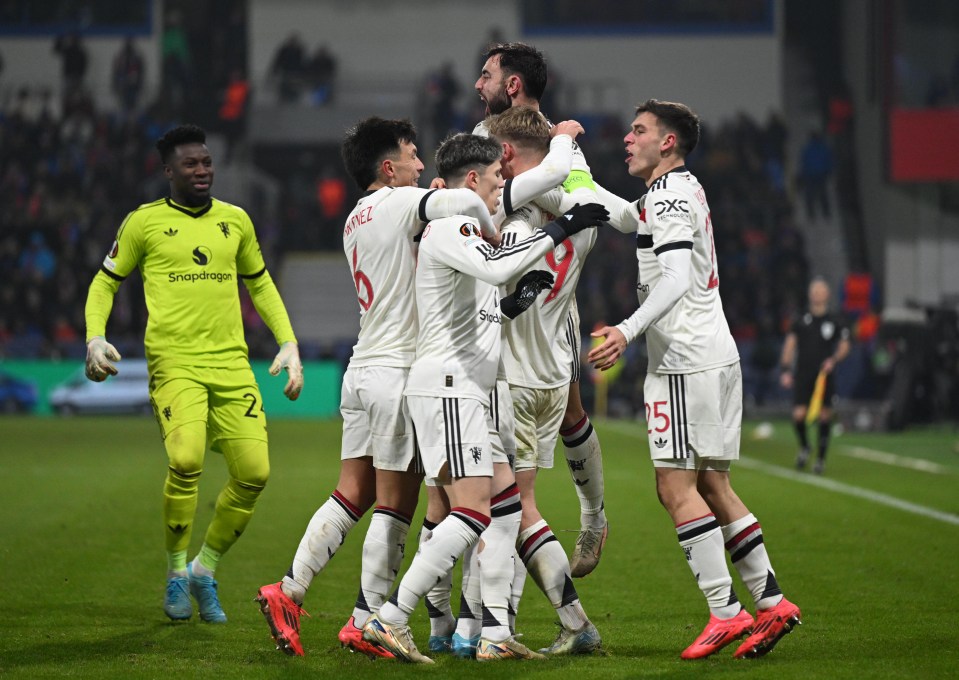 Manchester United players celebrating a goal.