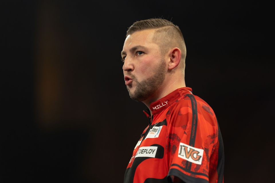 Nathan Aspinall reacting during his World Darts Championship quarter-final match.