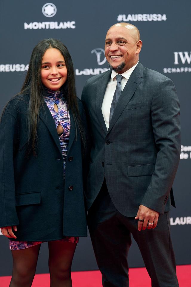 Roberto Carlos and his daughter on the red carpet at the Laureus World Sports Awards.