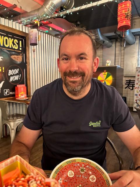 Man sitting at a restaurant table.