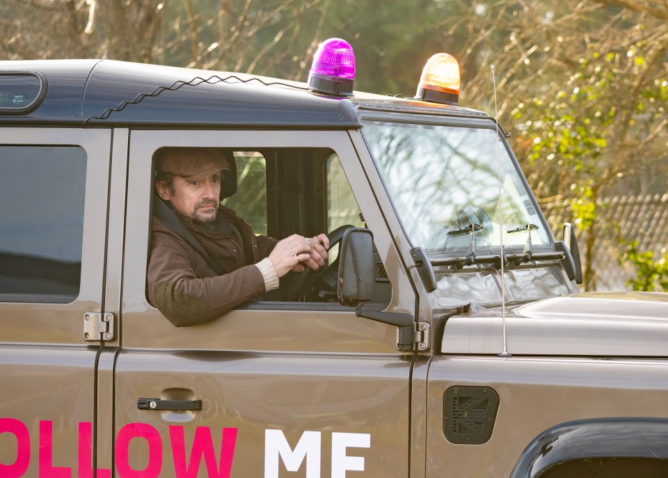 Richard Hammond driving a Land Rover.