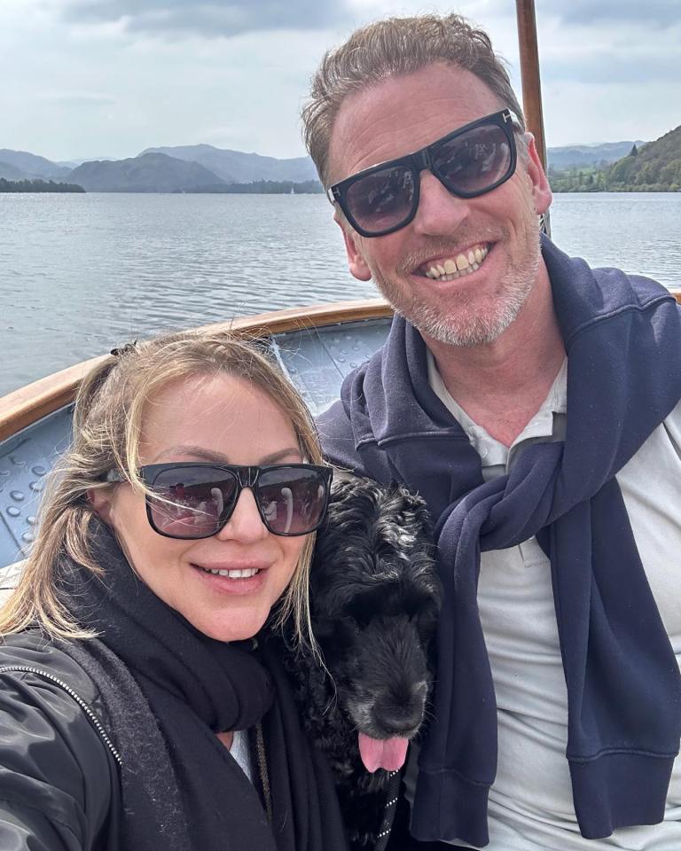 Couple and dog on a boat.