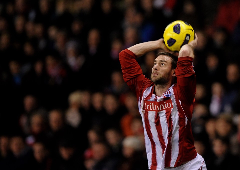 Rory Delap of Stoke City throws the ball in a soccer game.