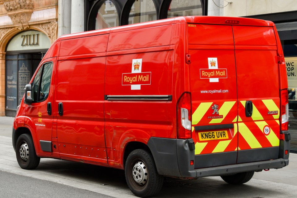 Royal Mail delivery van parked on a city street.