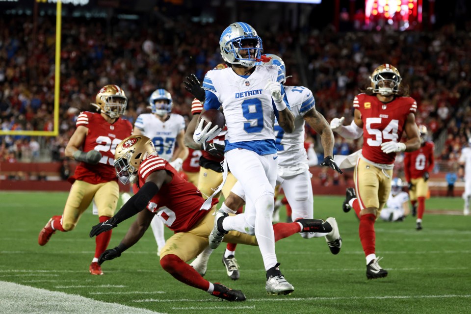 Jameson Williams #9 of the Detroit Lions scores a touchdown.