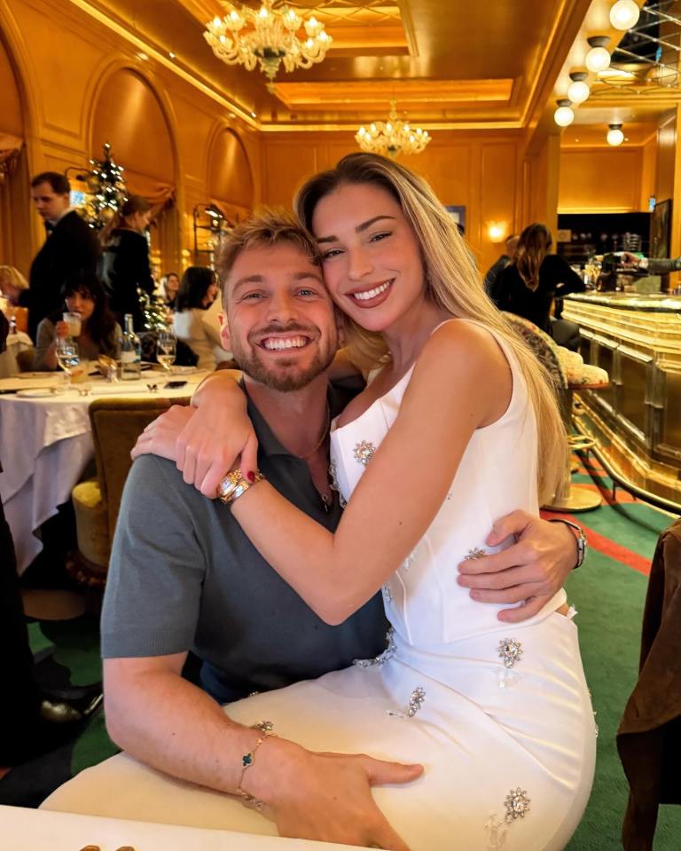 Couple embracing at a restaurant.