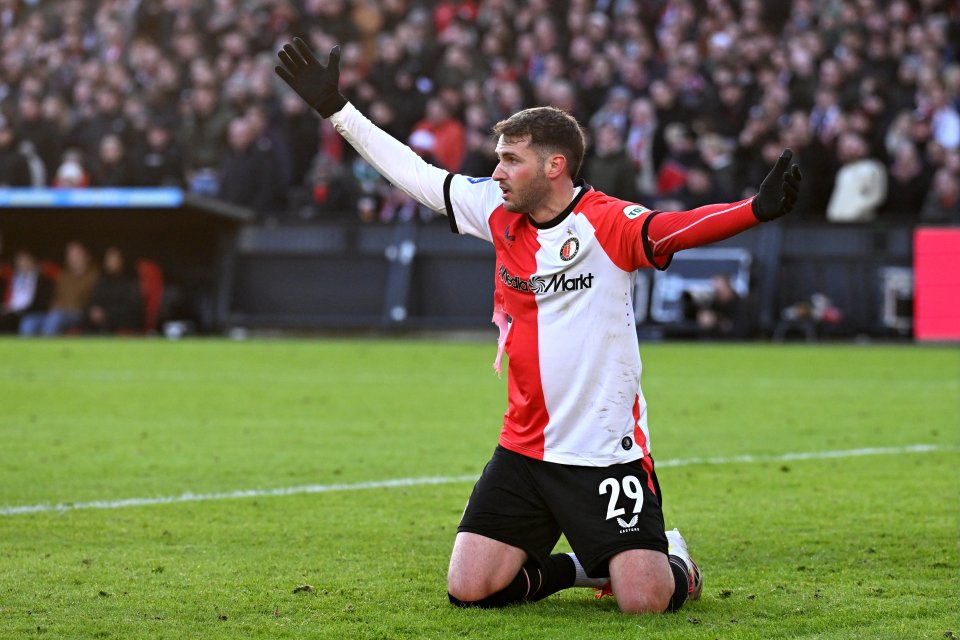 Santiago Gimenez of Feyenoord celebrates on his knees.