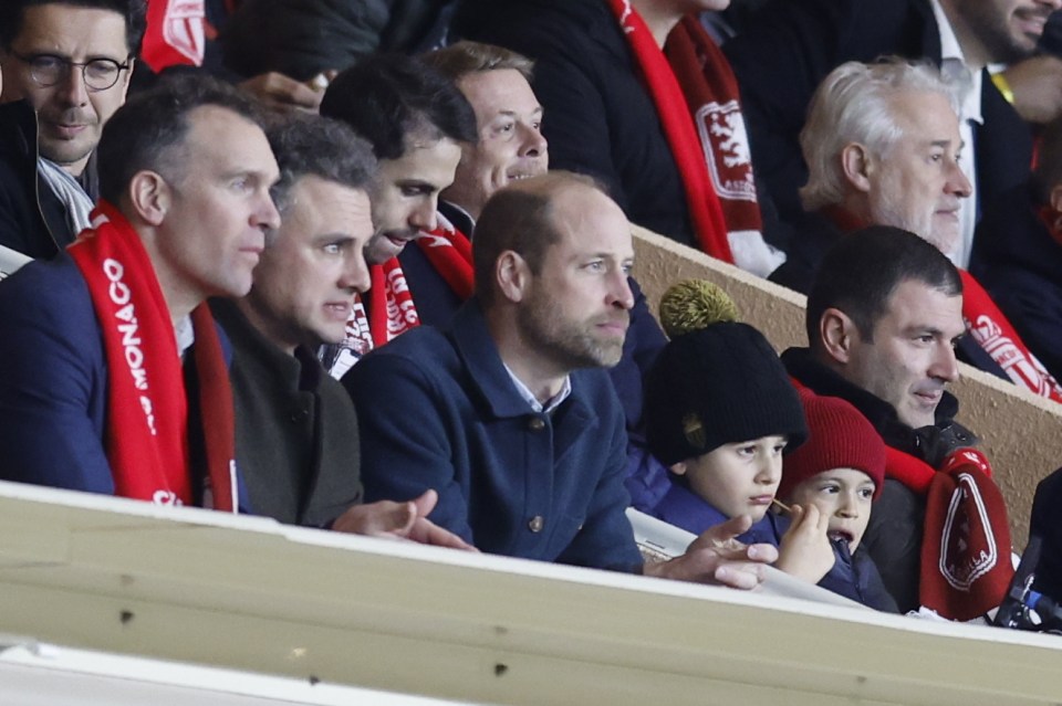 Prince William watching a soccer match.