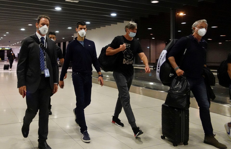 Novak Djokovic at an airport, departing after his visa was canceled.