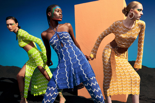 Three models in chevron-patterned knit dresses.