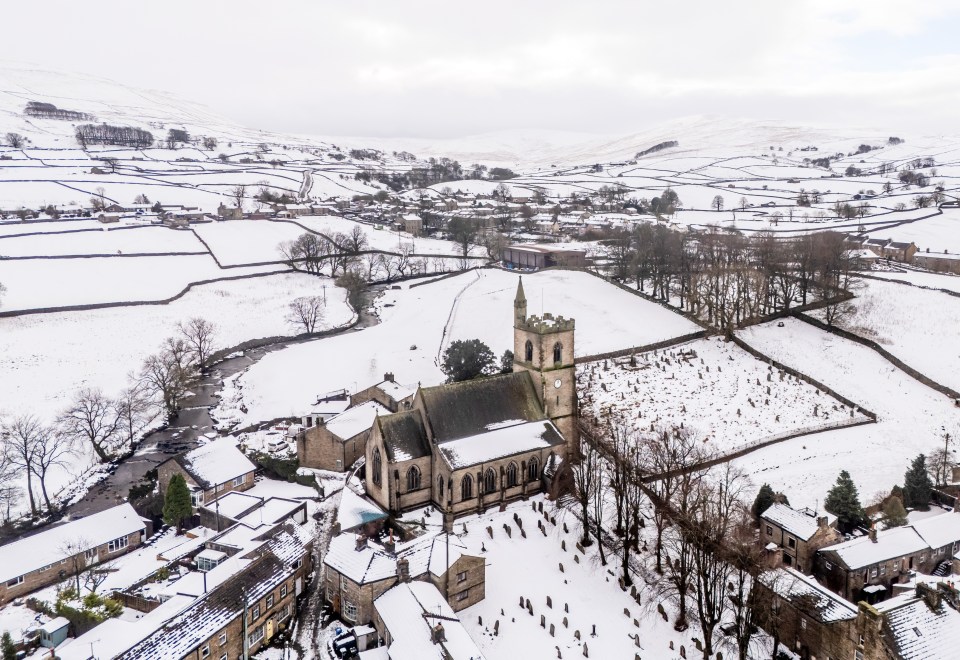 Aerial view of Hawes, Yorkshire Dales, covered in snow.