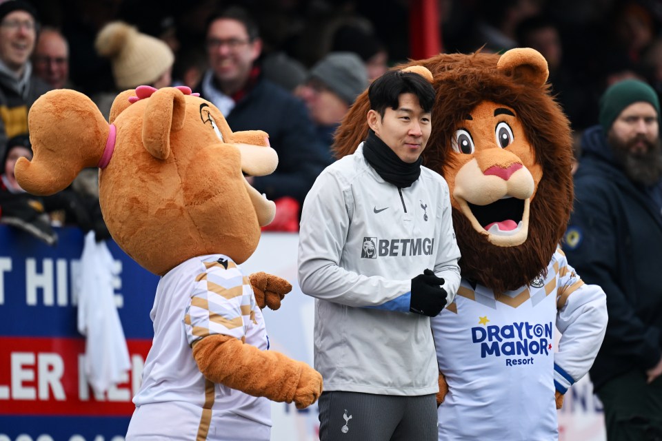 Son Heung-Min with mascots.