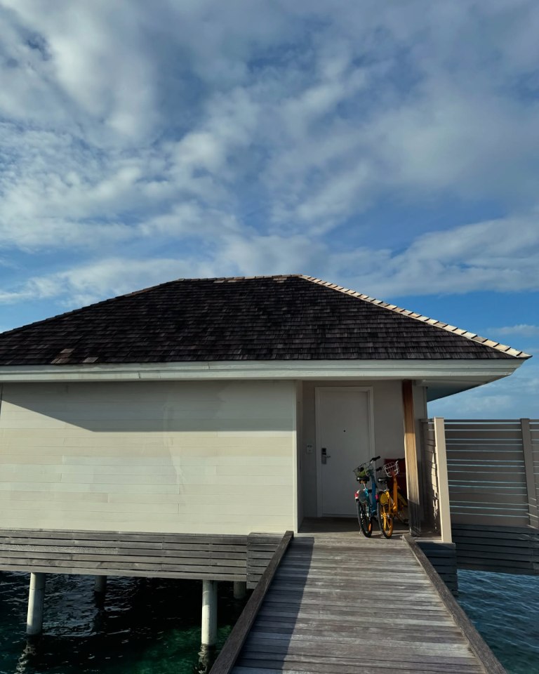 Overwater bungalow with two bicycles.