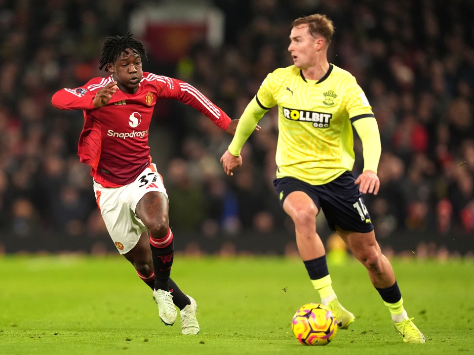 Manchester United's Kobbie Mainoo and Southampton's James Bree vying for the ball.