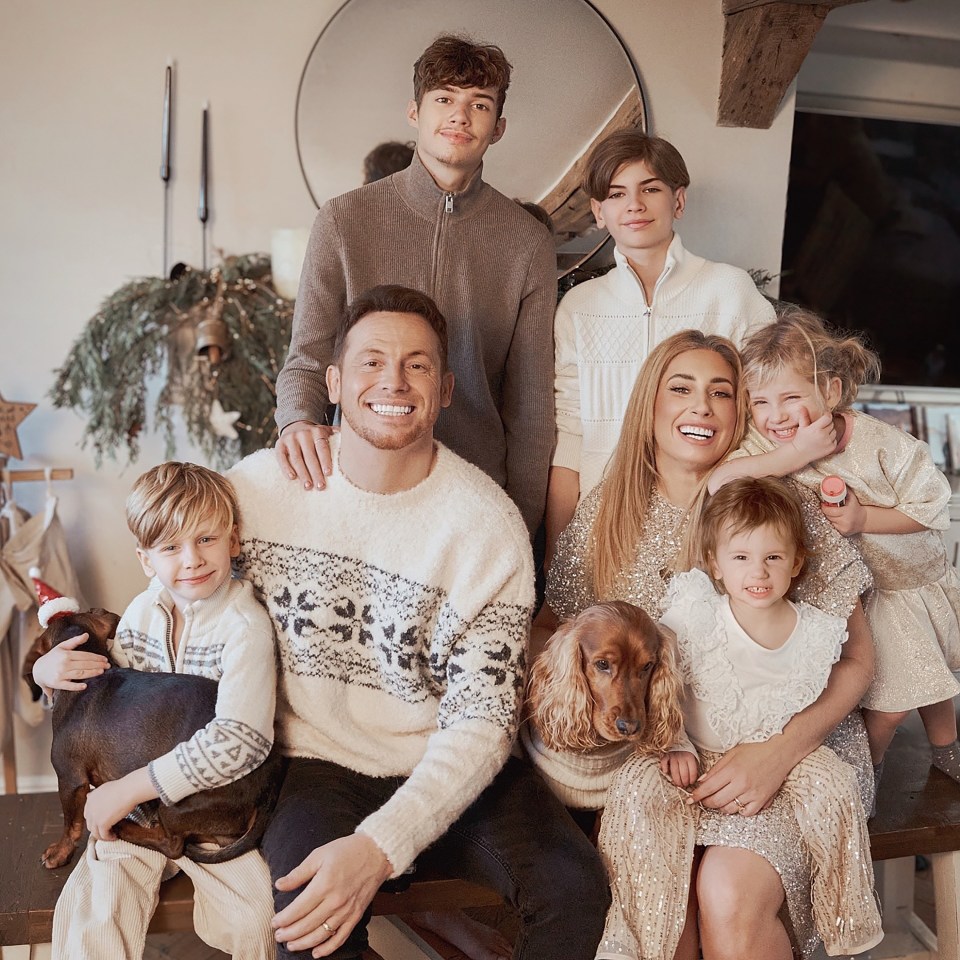 Family Christmas portrait with two dogs.