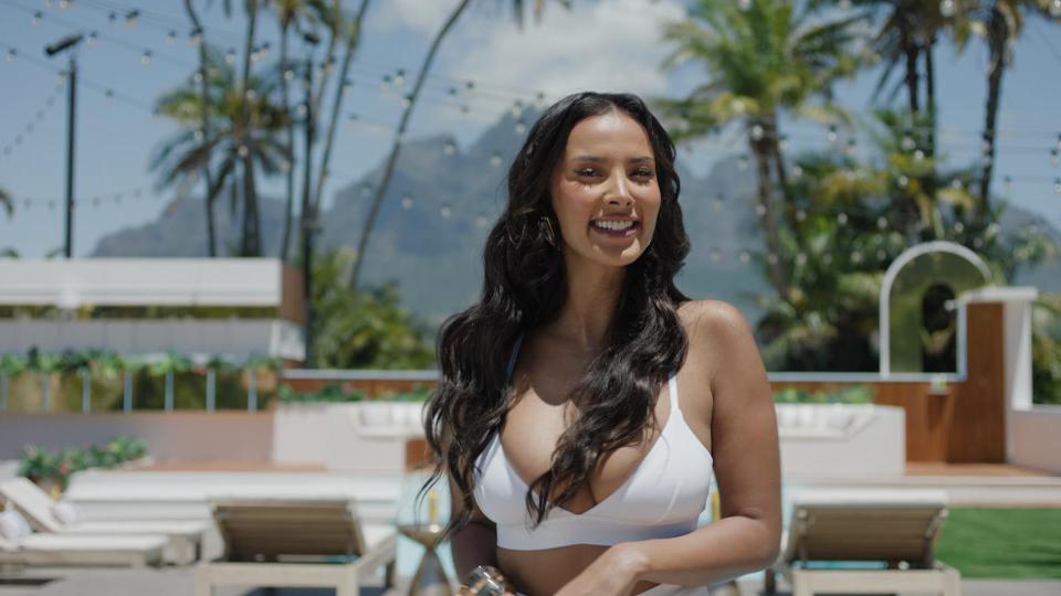 Maya Jama, host of Love Island: All Stars, smiling in a white bikini.