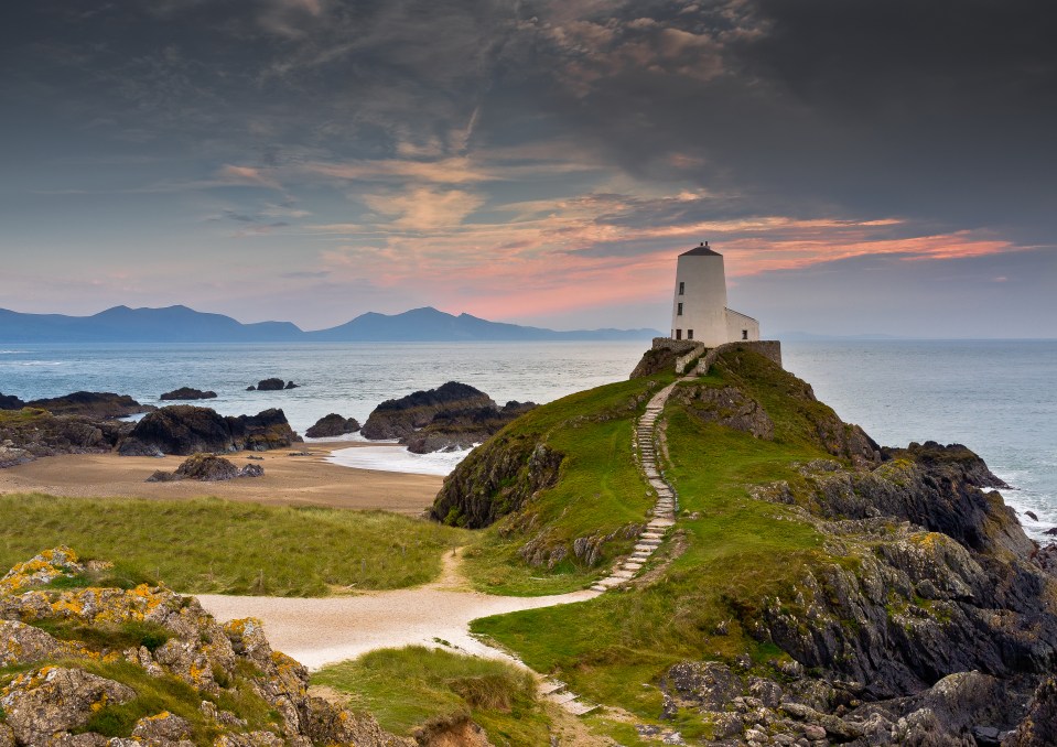 Located off the coast of Anglesey, the island can only be reached at low tide when a path emerges in the sand