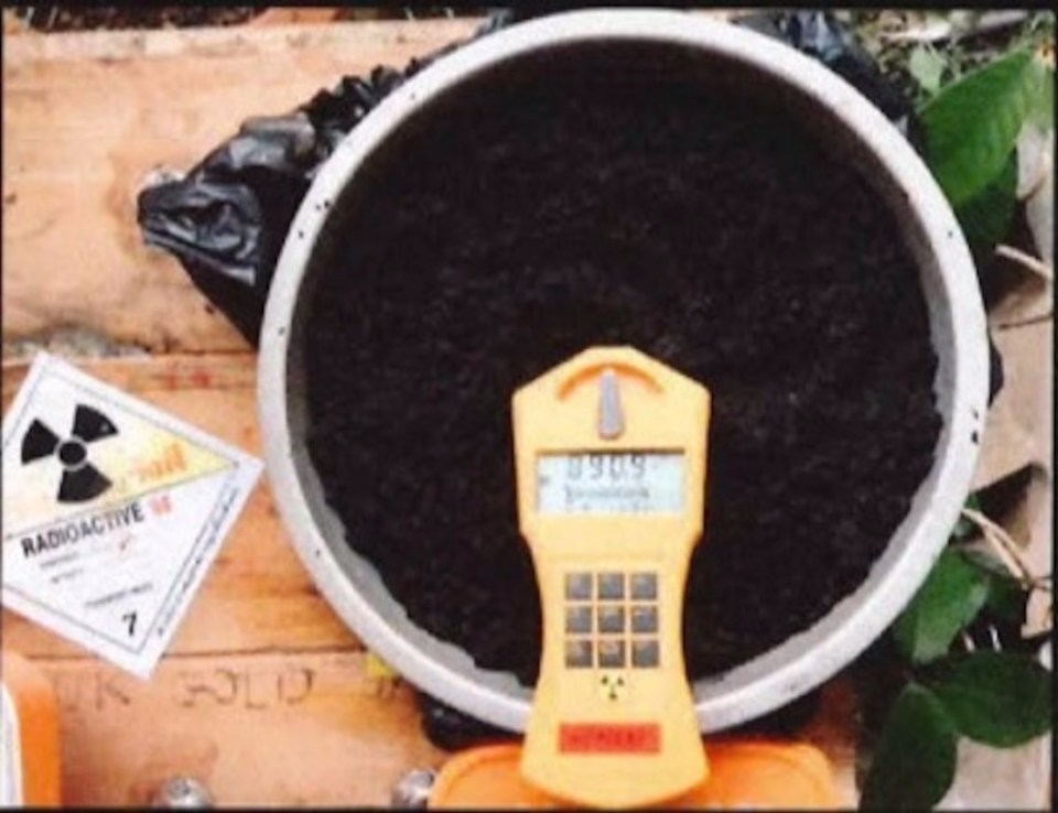 Radioactive material sample next to a Geiger counter.