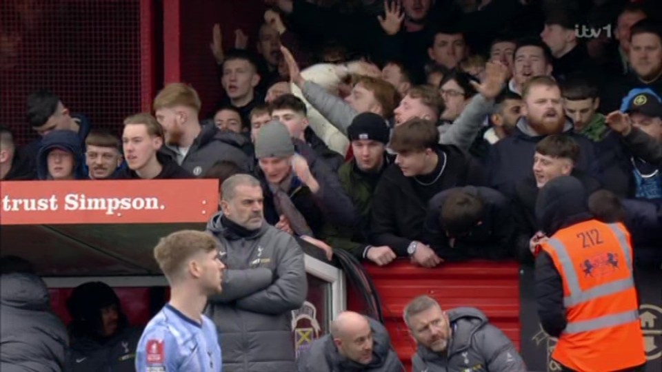 Tamworth fans near the Tottenham dugout.