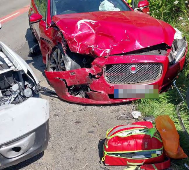 Two cars damaged in a head-on collision.