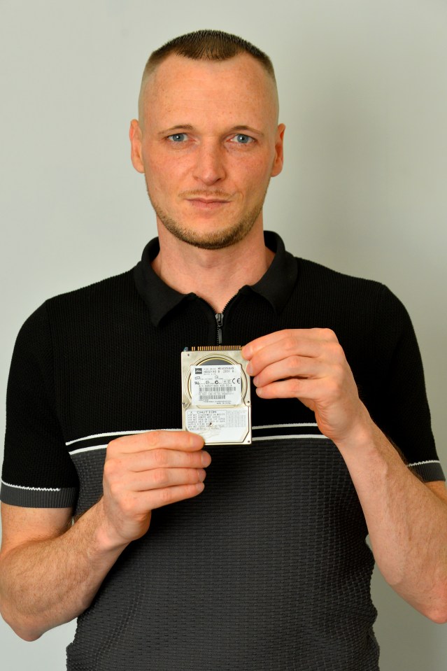 Man holding a hard drive containing £600 million in Bitcoin.