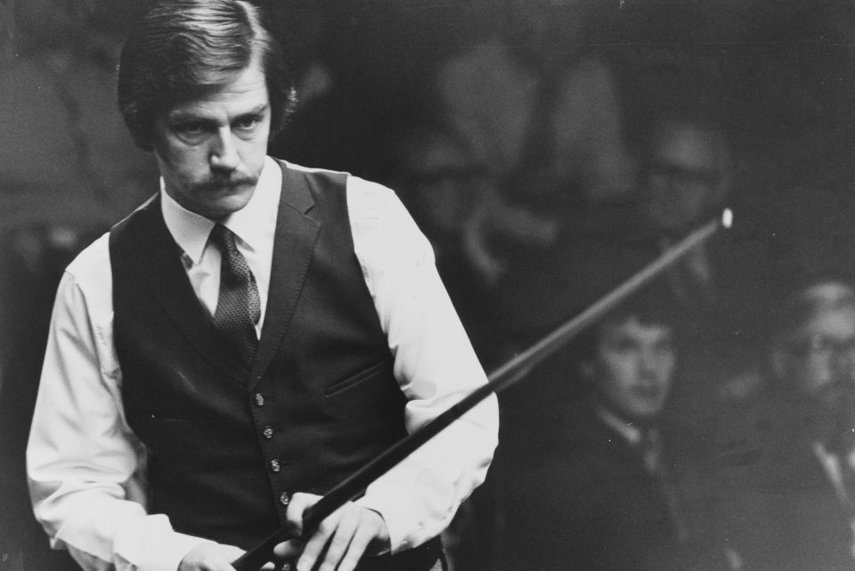 Black and white photo of Cliff Thorburn playing snooker.