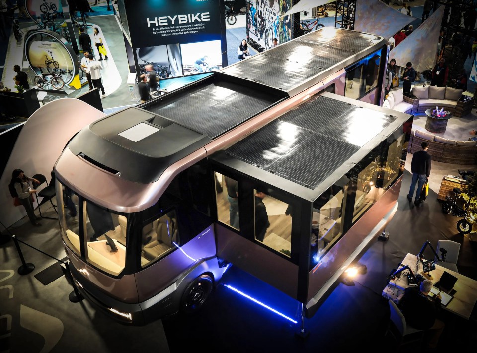 Expandable electric motorhome with solar panels on the roof.