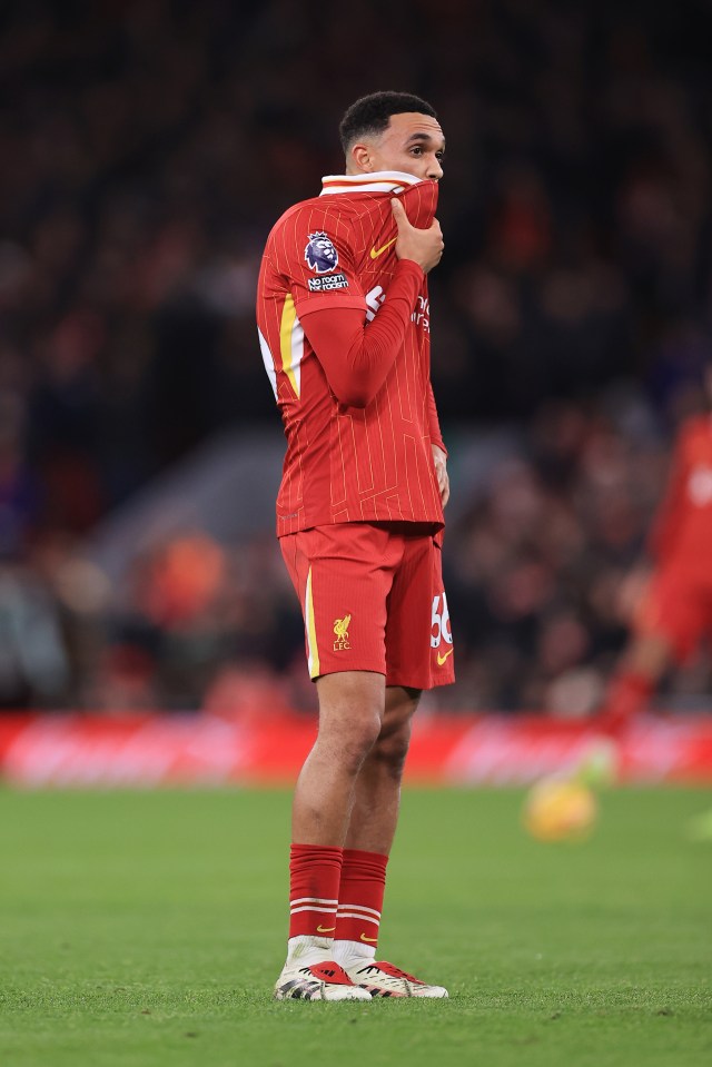 Trent Alexander-Arnold of Liverpool looking dejected on the field.