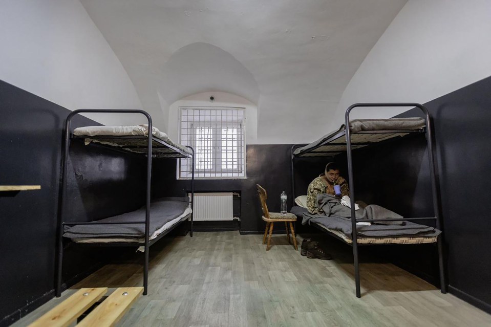 Two captured North Korean soldiers in a prison cell.