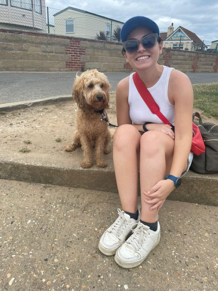 Woman sitting with her dog.