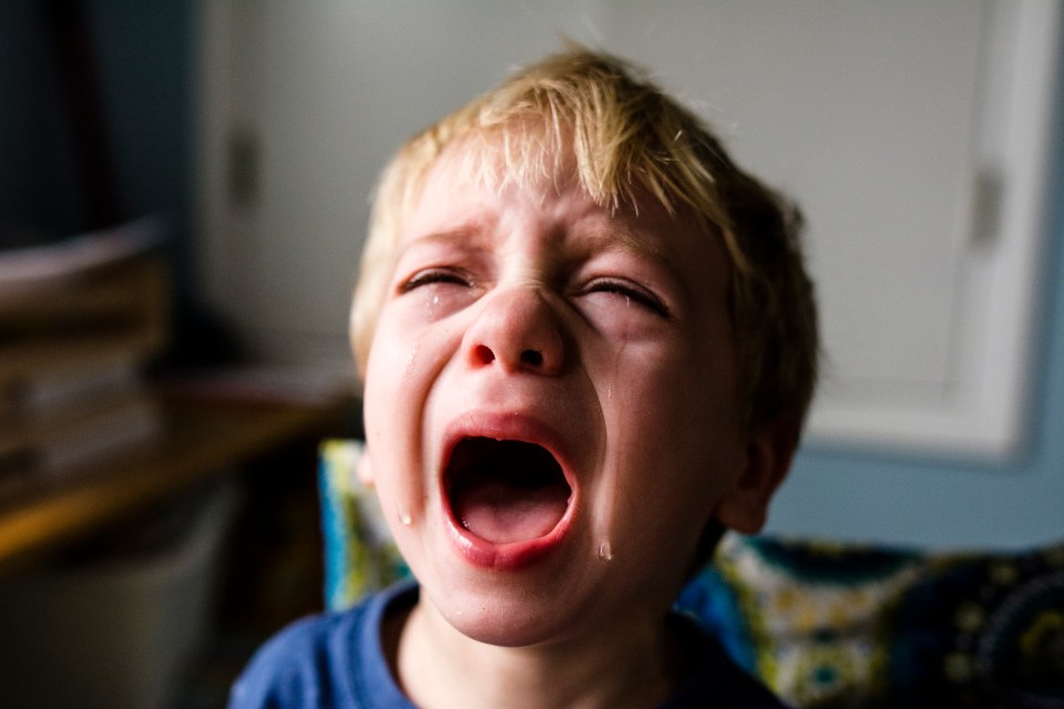 A toddler crying.