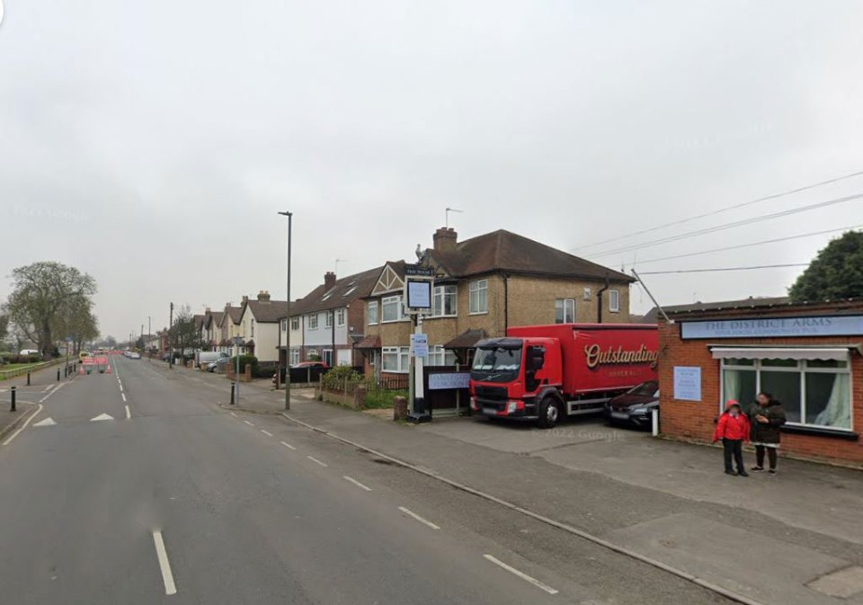 Street view of residential homes and The District Arms pub.