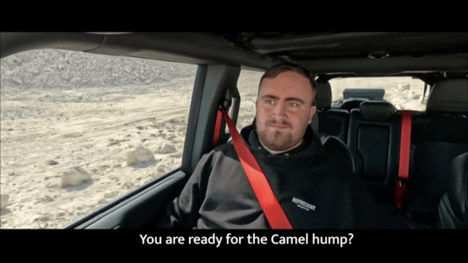 Man in a Jeep, asking if the viewer is ready for the camel hump.