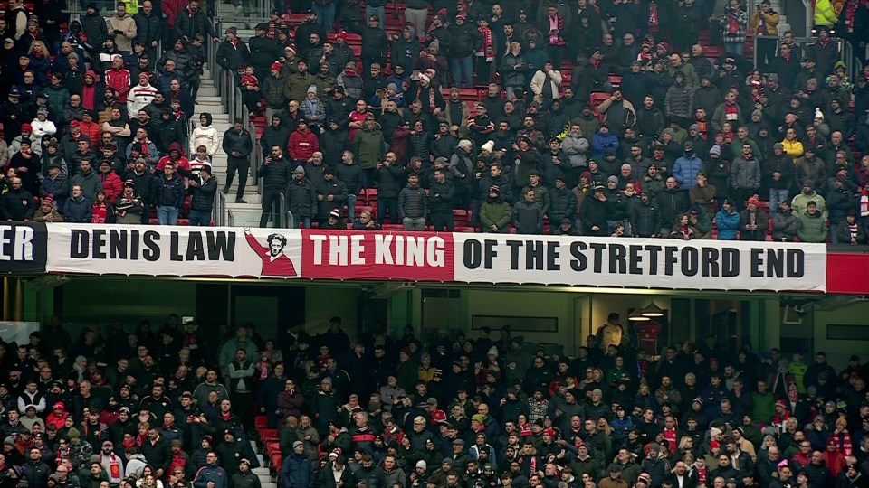 Banner at a stadium reading "Denis Law The King of the Stretford End".