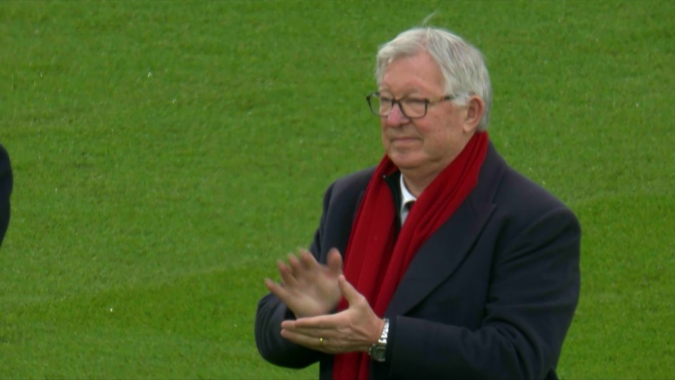 Sir Alex Ferguson clapping.