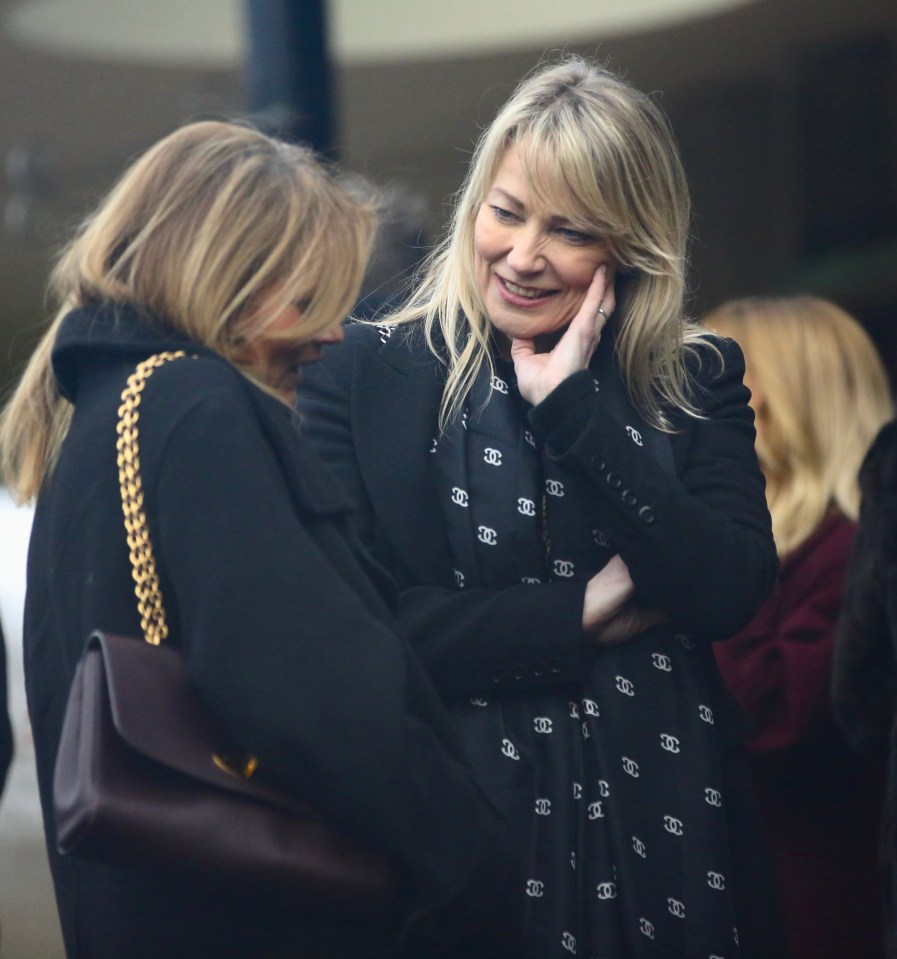 Two women at a funeral.