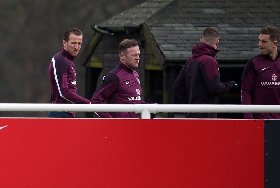 Harry Kane and Wayne Rooney at a soccer training session.