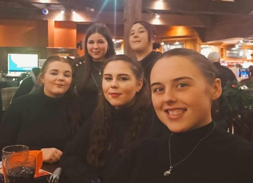 Group photo of five young women.