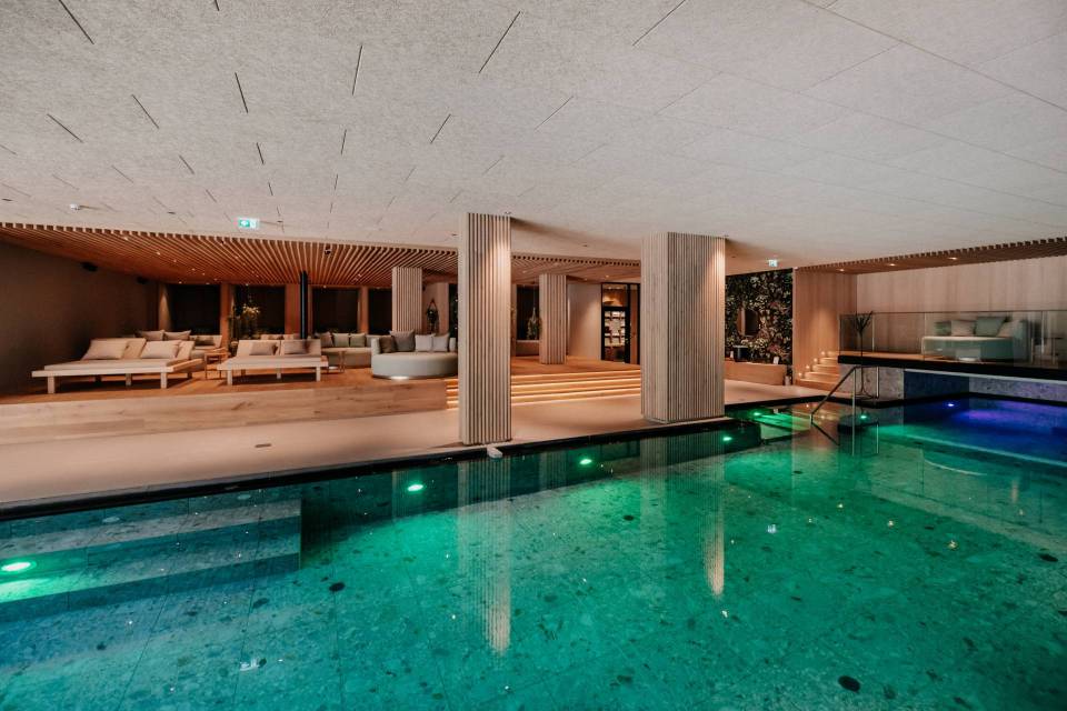 Indoor pool and relaxation area in a spa.