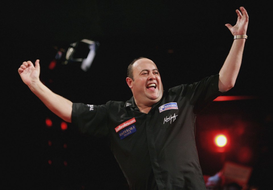 Wynand Havenga celebrating a darts championship win.